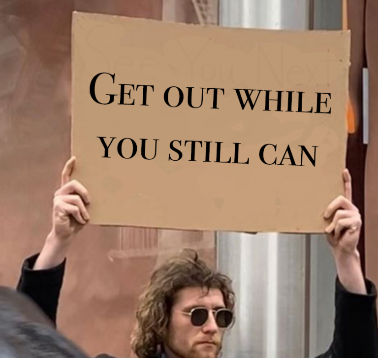 Guy with a sign saying "Get out while you still can"